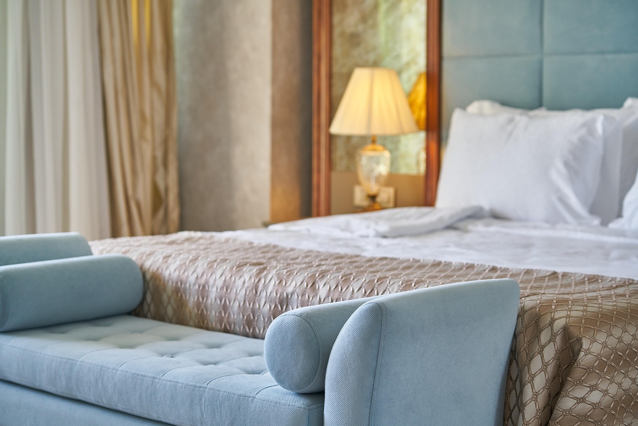 Quiet heritage hotel bedroom with linen and wood